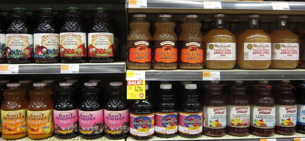Juices crystal bottles on a supermarket shelf