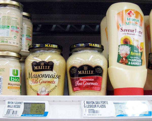 Mayonnaise bottles on a supermarket shelf