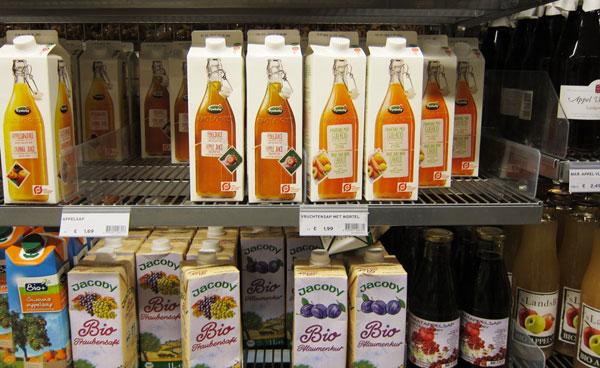 Danish orange Juice carton packaging with a juice bottle printed on it